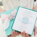 Quinceanera Invitation, a person holding a box with a Quinceanera program in it
