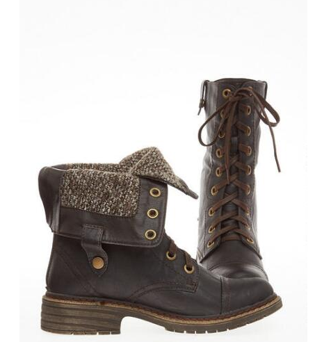 A pair of women's brown work boots with laces, perfect for a Quinceanera