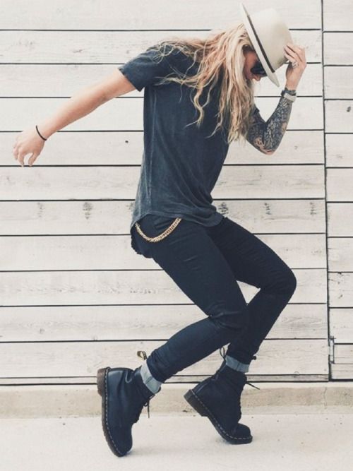 A Quinceanera outfit for a tomboy, featuring a man wearing a hat and jeans while skateboarding with boots.