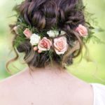 Quinceanera hairstyle, a woman with flowers in her hair