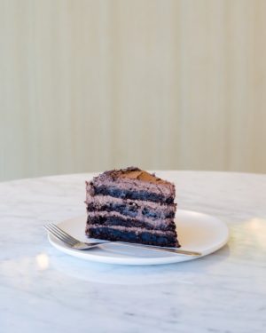 A Quinceanera themed image showing a plate with a fork, and a choice between ice cream and a piece of chocolate cake