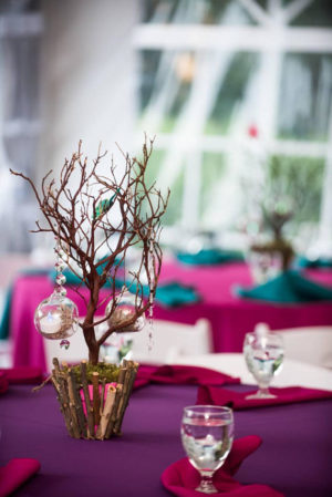 Quinceanera centrepiece, a table with a purple table cloth and a purple table cloth