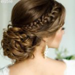 Quinceanera bridesmaid updo hairstyle, a woman with a braid updo in her hair