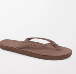 A pair of brown Quinceanera flip flop sandals
