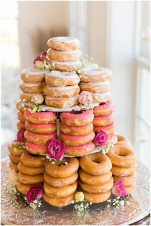 A Quinceanera cake alternative - a tower of doughnuts with flowers on top