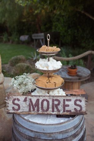 Quinceanera decoration ideas, a wooden sign that says s'mores on it