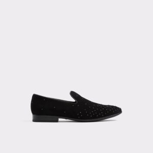 A pair of slip-on shoes with studded detailing, perfect for a Quinceanera outfit
