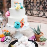 Quinceanera cake, a white Quinceanera cake sitting on top of a table