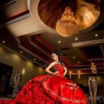 Quinceañera dresses, a woman in a red dress posing for a picture, peinados de xv años con sombrero