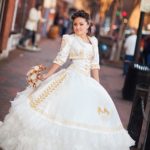 Quinceañera dresses, a woman in a white dress is posing for a picture vestidos de escaramuza para Quinceañera