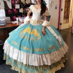 Quinceañera dresses, a woman in a fancy dress poses for a picture, quinceañera de escaramuza