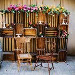 Quinceanera party decoración de fiesta parrillero, with a wooden chair next to a wooden shelf