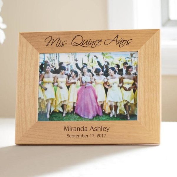 A Quinceanera-themed picture frame with a picture of a Quinceanera party