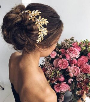Quinceanera: A woman in a black dress holding a bouquet of flowers