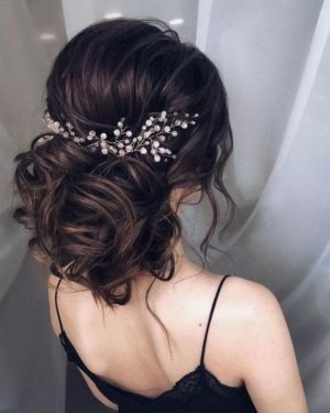 Quinceanera hairstyle, a woman with a hair comb in her hair