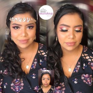 A beautiful woman in a black dress with a crown on her head, showcasing her hair coloring for a Quinceanera event