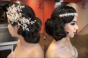 A Quinceanera with a bride veil and a woman wearing a hair comb in her hair