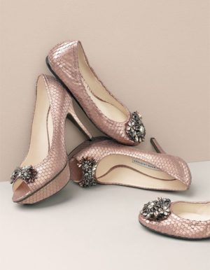 A pair of pink high-heeled shoes sitting on top of each other