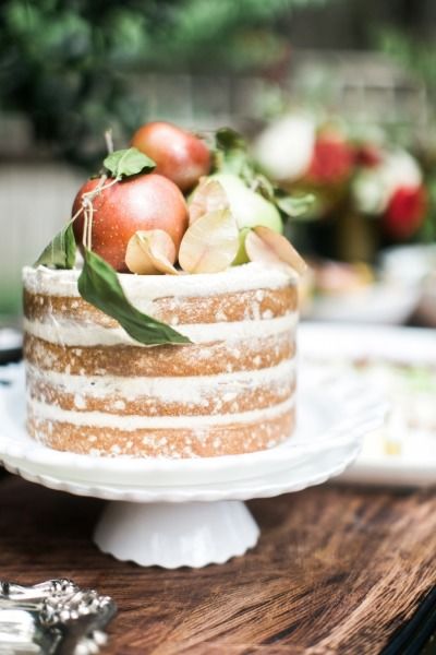 A close up of a buttercream Pavlova cake on a table for a Quinceanera celebration.