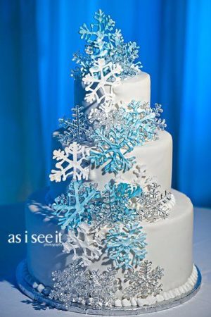 Quinceanera winter cake, a three tiered cake with snowflakes on top