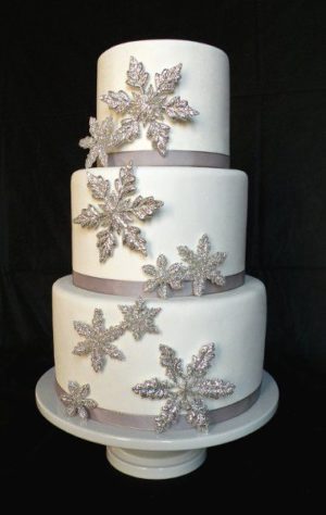 Quinceanera cake, a three tiered cake with snowflakes on it