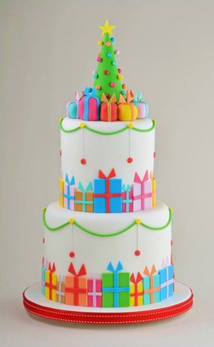 A funny Quinceanera cake idea. The cupcake is a three-tiered cake decorated with presents and a Christmas tree.