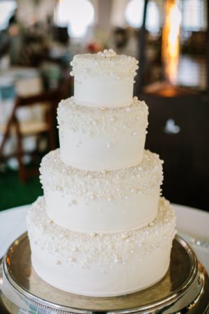 Quinceanera cake, a classic white cake on a silver platter