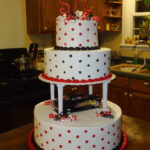 Quinceanera cake, a three-tiered cake sitting on top of a table
