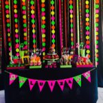 Quinceanera fiesta decoracion fluor Party, a black table topped with lots of candy