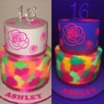 A couple of glow in the dark Quinceanera cakes sitting on a table