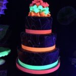 A Quinceanera cake, a three-tiered cake that glows in the dark