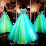 Neon glow in the dark Quinceañera dresses, a couple of dresses that are on display