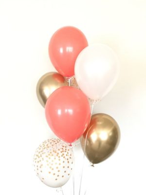 A bunch of Quinceanera balloons on a stick