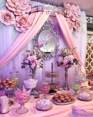Quince candy table, a table topped with lots of desserts and pastries