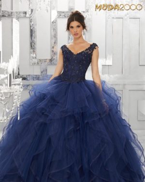 Shades of blue Quinceanera Quinceañera dresses, a woman in a ball gown posing for a picture