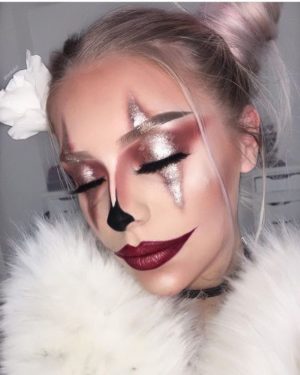 Quinceanera image: A woman with makeup and a white fur coat, resembling a clown