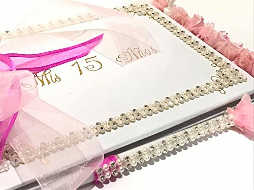 A lilac Quinceañera, featuring a wedding album tied with a pink ribbon and adorned with pearls