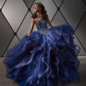 Gown Quinceañera dresses: a woman in a blue dress posing for a picture