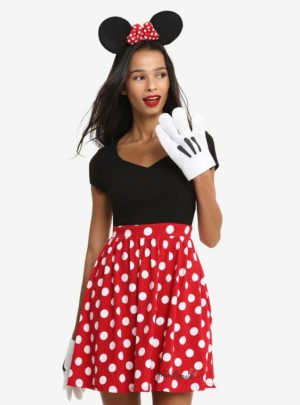 A Quinceanera woman dressed in a Minnie Mouse polka dot dress and a woman dressed in a Minnie Mouse costume