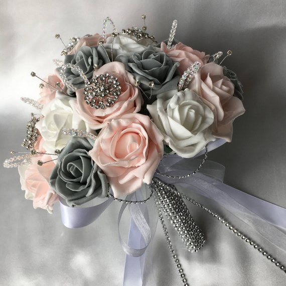 Quinceanera flower bouquet, a bouquet with roses, pearls, and flowers
