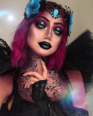 A dark fantasy fairy with purple hair and a black dress, in a Quinceanera theme