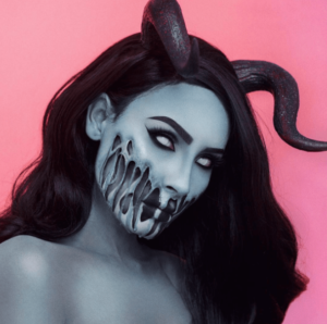 A Quinceanera image featuring desi perkins demon Valac, a woman with horns painted on her face