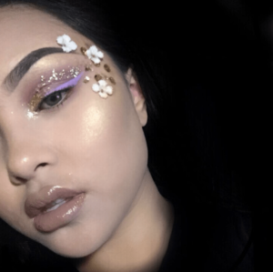 A close-up of a person with makeup for a Quinceanera