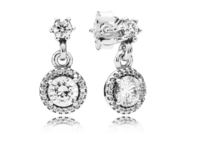 A pair of diamond earrings on a white background