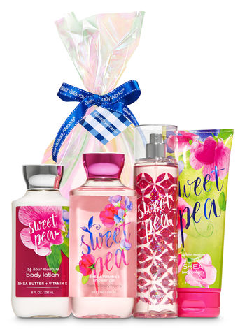 A gift basket filled with a group of Quinceanera-themed bath and body products from Bath & Body Works