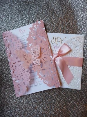 Quinceanera Invitation, a pink and white card with a pink ribbon and butterfly design