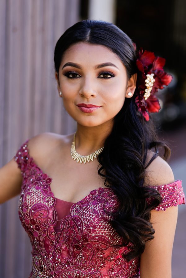 Quinceanera beauty Hair Accessory, a woman in a pink dress posing for a picture