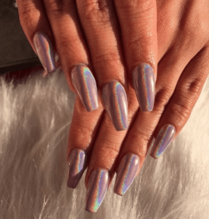 A woman's hand with a shiny manicure for a Quinceanera