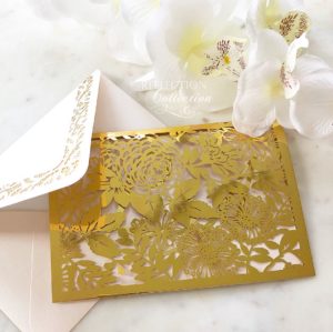 A close up of a Quinceanera party invitation card on a table