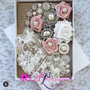 A beautiful Quinceanera bouquet featuring a mixture of colorful flowers including petals and a variety of blooms arranged in a box